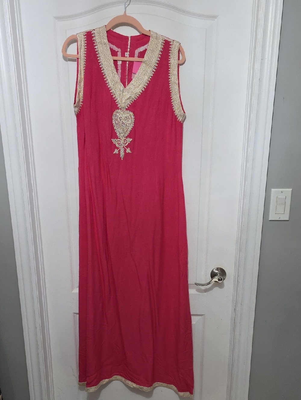 Sleeveless Pink Maxi Dress with Gold Trim and Embellished Medallion